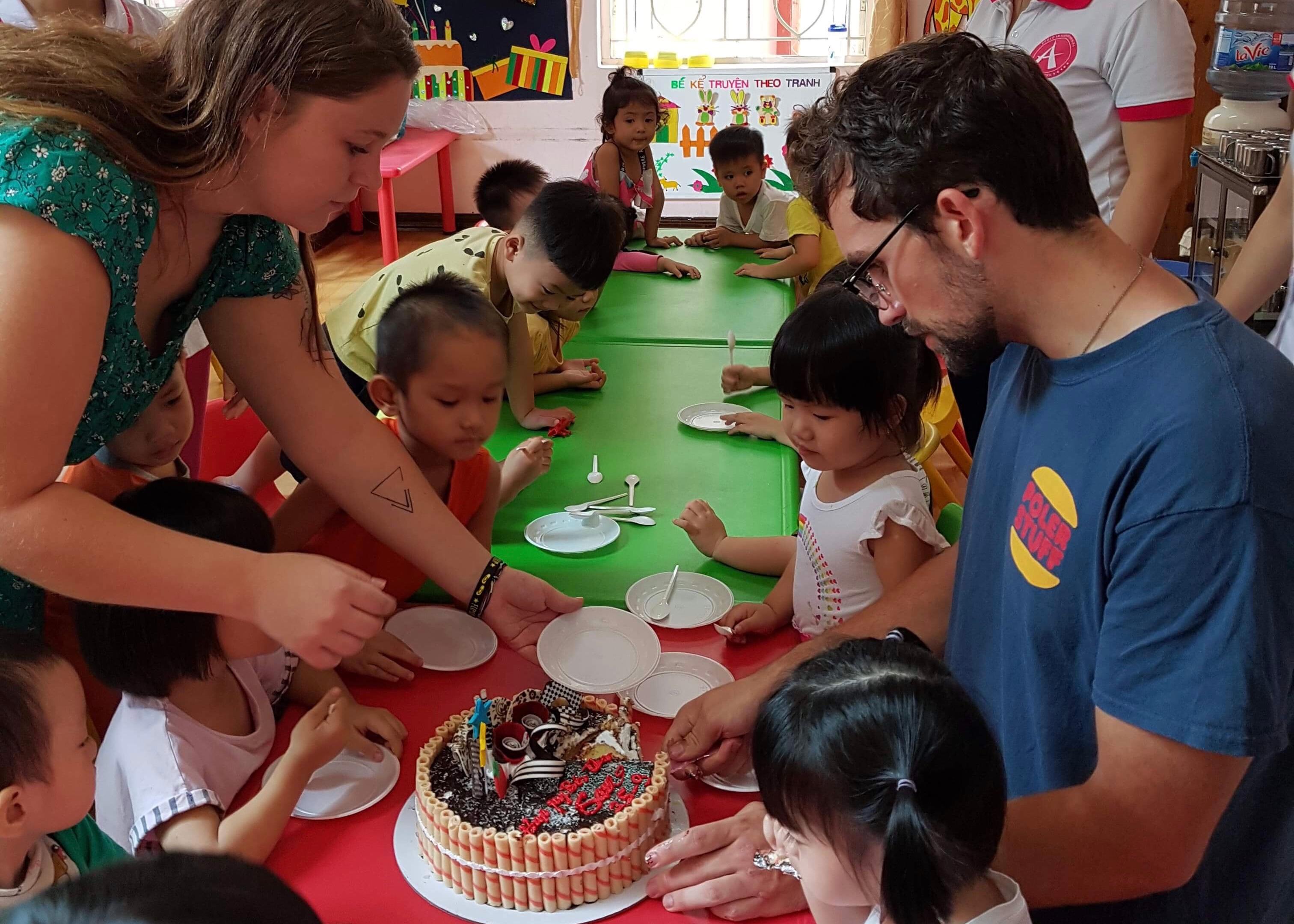 Serving a cake to the kids.JPG
