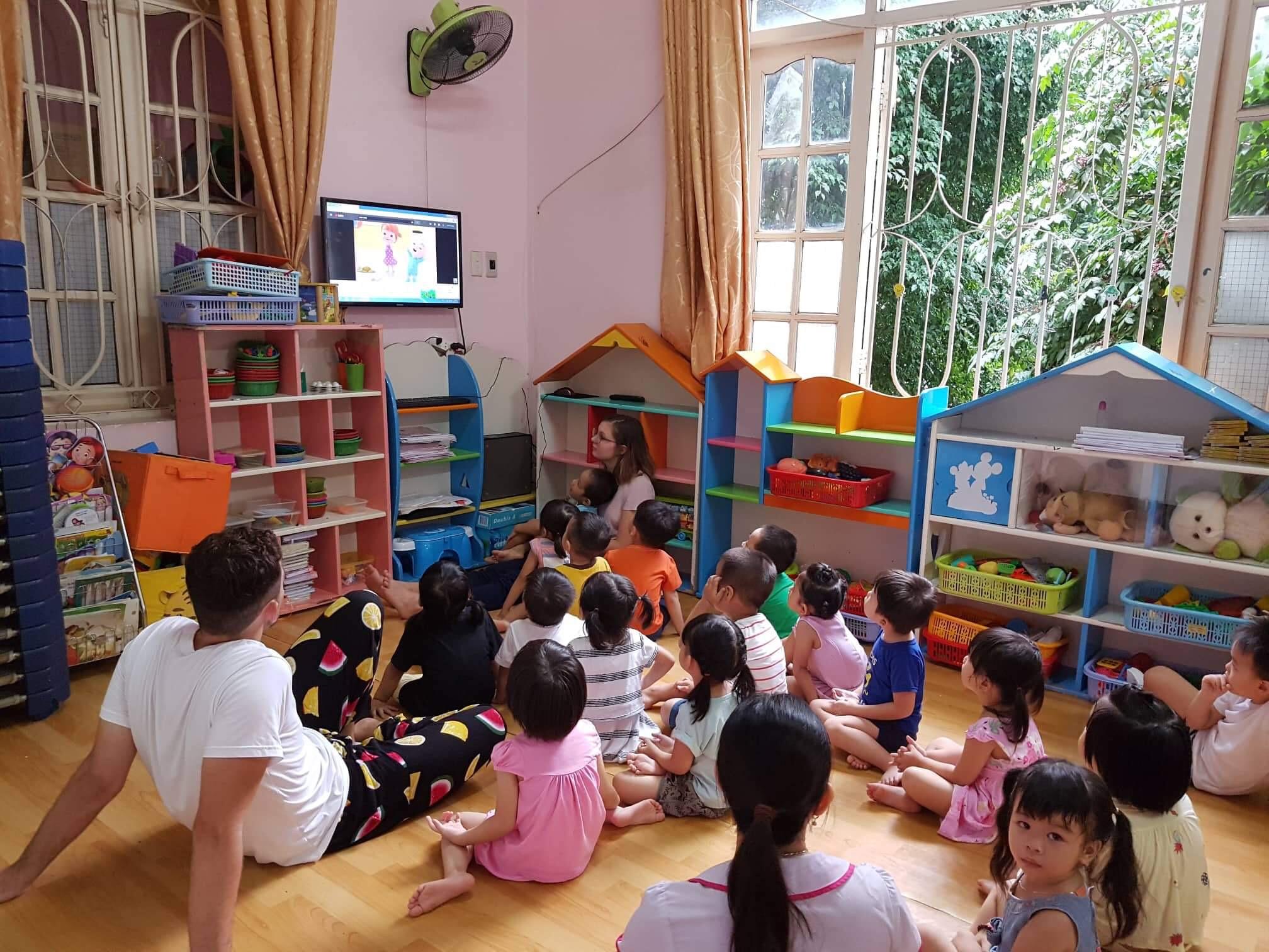 Participant watching cartoon with kids.JPG